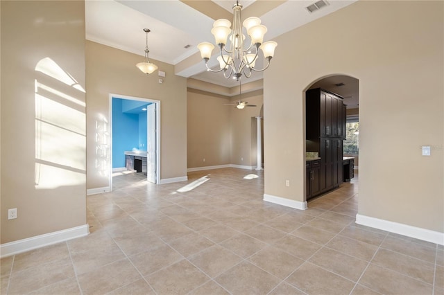 spare room featuring crown molding, light tile patterned floors, and ceiling fan with notable chandelier