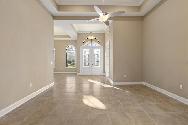 tiled entryway featuring ceiling fan