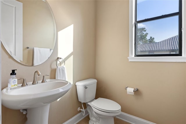 bathroom featuring toilet and sink