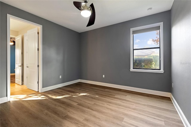 unfurnished room with ceiling fan and light hardwood / wood-style flooring