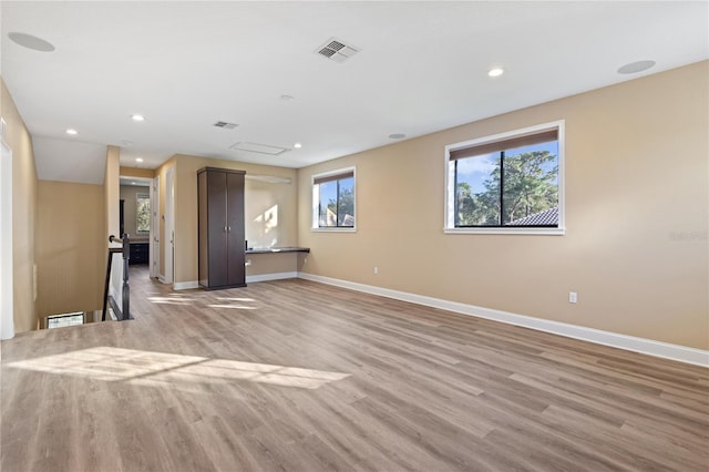 unfurnished living room featuring light hardwood / wood-style floors