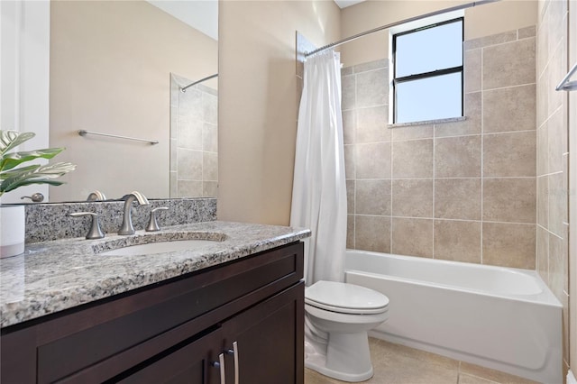 full bathroom with tile patterned floors, vanity, toilet, and shower / tub combo with curtain