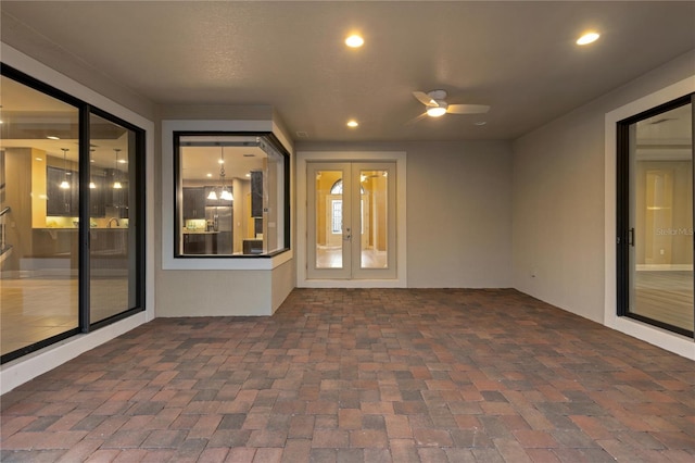 view of patio with ceiling fan and french doors