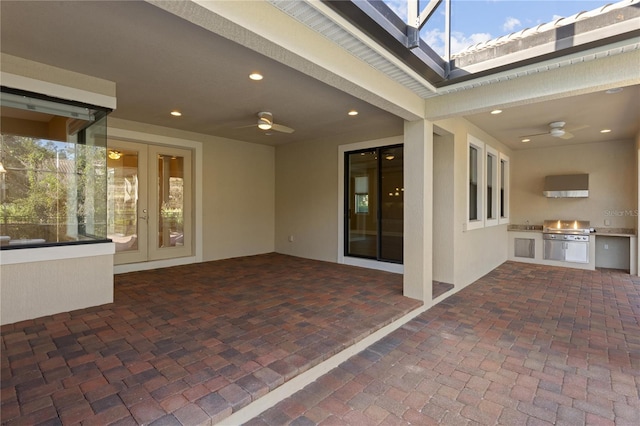 view of patio / terrace featuring area for grilling, ceiling fan, and a grill