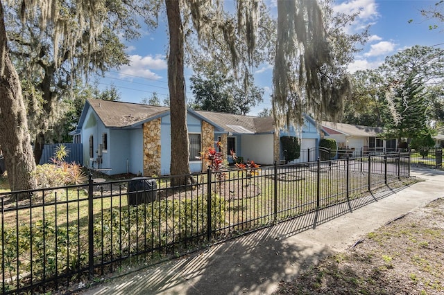 single story home with a front lawn and a garage