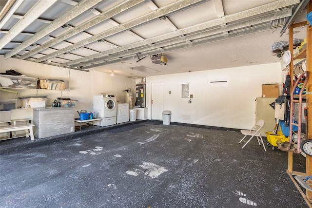 garage with electric water heater, washer and clothes dryer, and a garage door opener