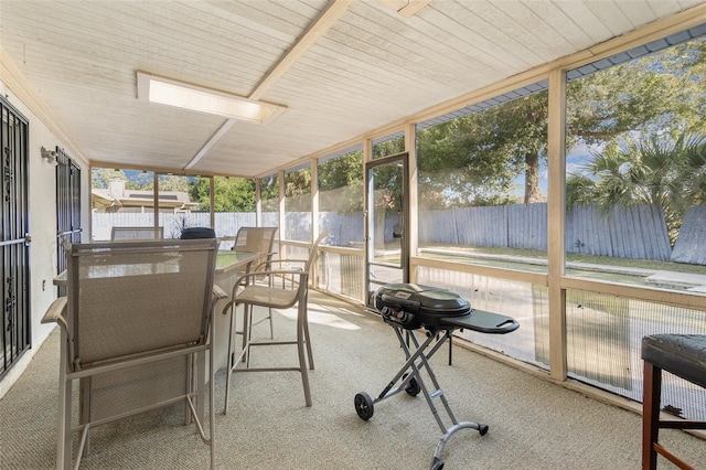 sunroom with wooden ceiling