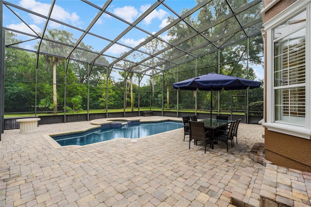 view of pool featuring a patio, glass enclosure, and an in ground hot tub