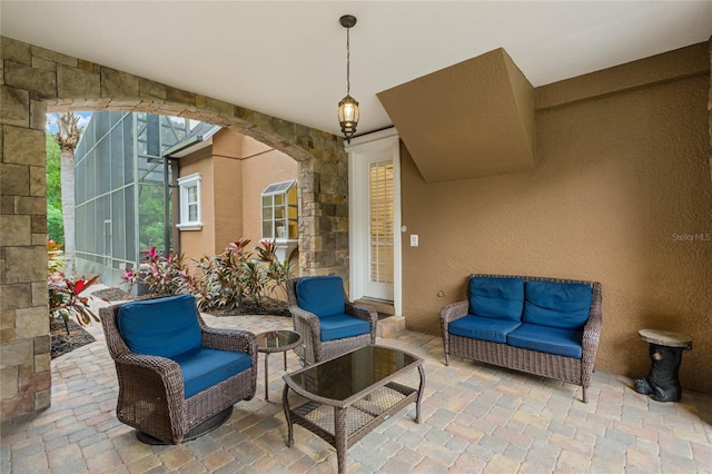 view of patio / terrace with glass enclosure and an outdoor hangout area