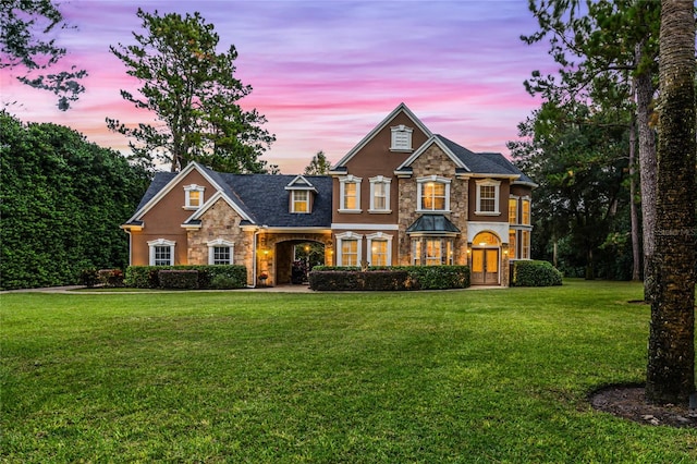 craftsman house with a lawn