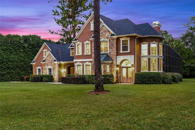 view of front of home with a lawn