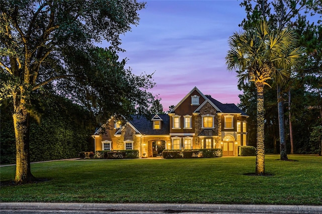 view of front of property with a yard