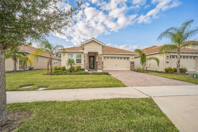 view of front of home featuring a garage and a front lawn