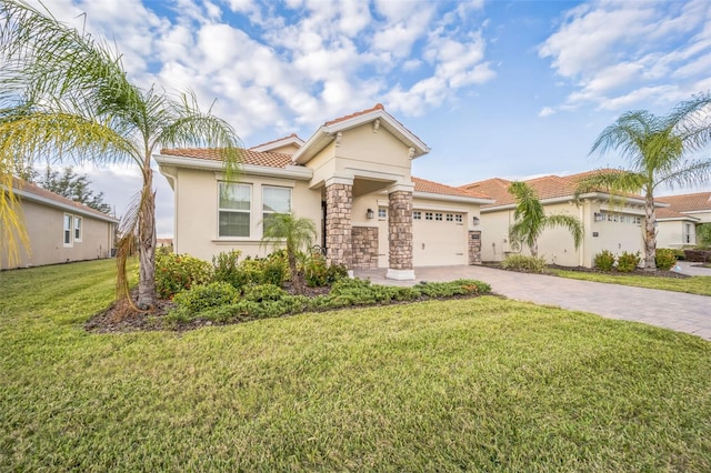 mediterranean / spanish-style home with a garage and a front lawn