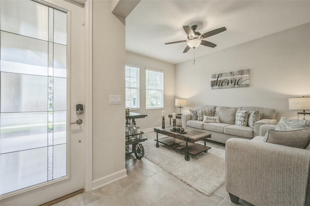 tiled living room featuring ceiling fan