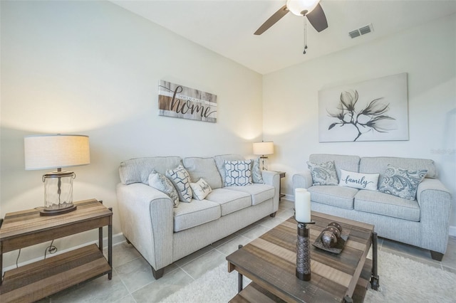 living room with light tile patterned floors and ceiling fan