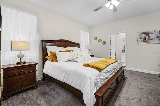 carpeted bedroom with ceiling fan and ensuite bath