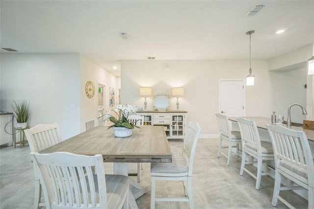 dining space featuring sink