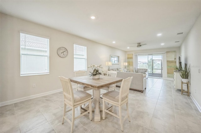 dining room with light tile patterned floors and ceiling fan