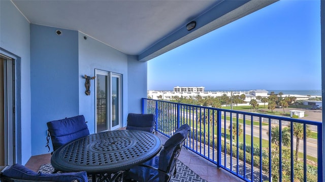 balcony featuring a water view