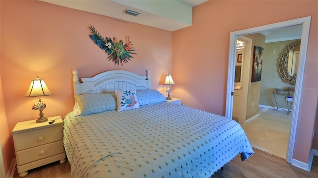 5300 S Atlantic Ave Unit 2-502, New Smyrna Beach, FL 32169 - bedroom featuring baseboards and wood finished floors