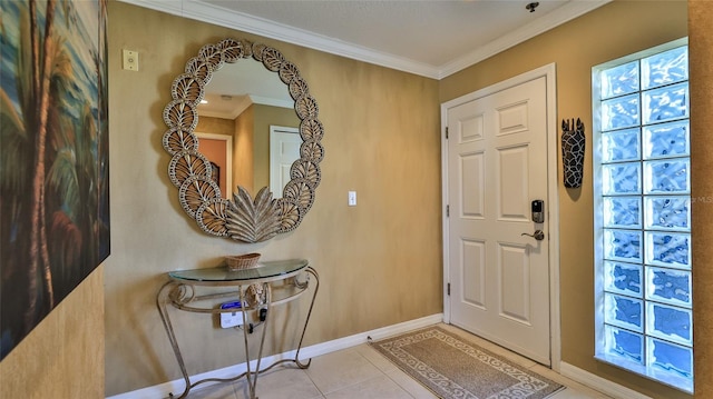 tiled entrance foyer featuring ornamental molding