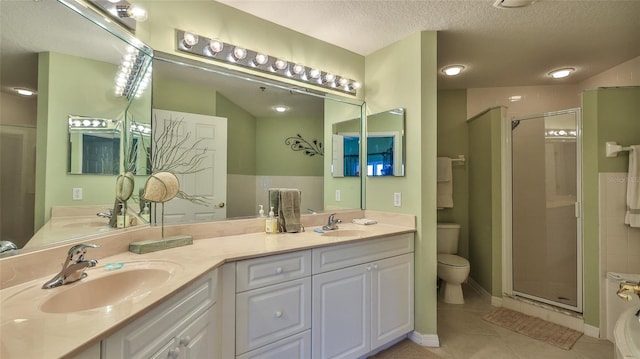 5300 S Atlantic Ave Unit 2-502, New Smyrna Beach, FL 32169 - full bathroom featuring tile patterned flooring, toilet, double vanity, a shower stall, and a textured ceiling