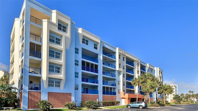 5300 S Atlantic Ave Unit 2-502, New Smyrna Beach, FL 32169 - view of apartment building / complex with uncovered parking