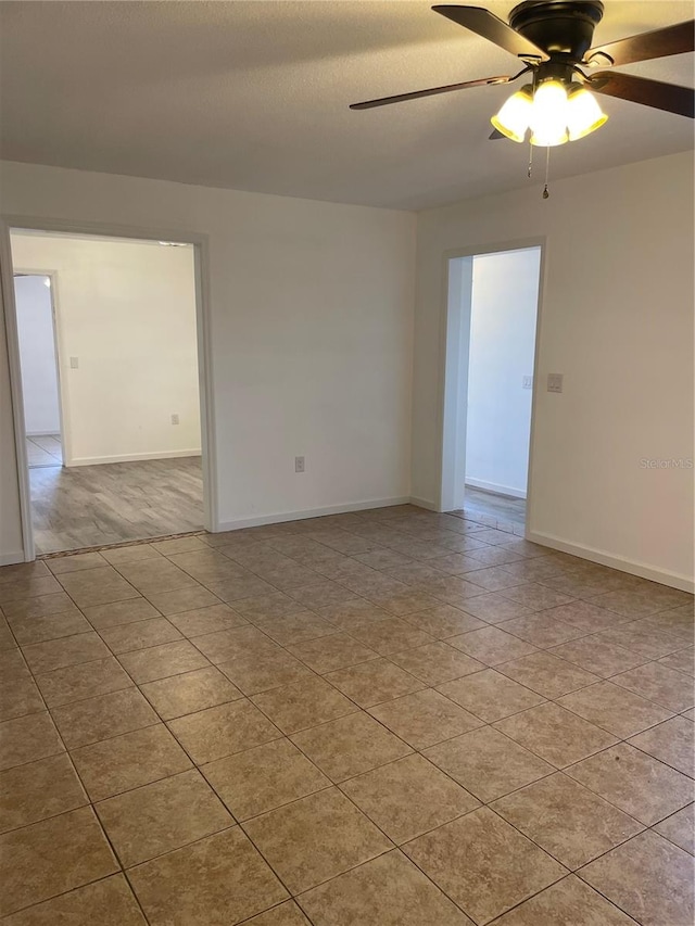 unfurnished room featuring a textured ceiling and ceiling fan