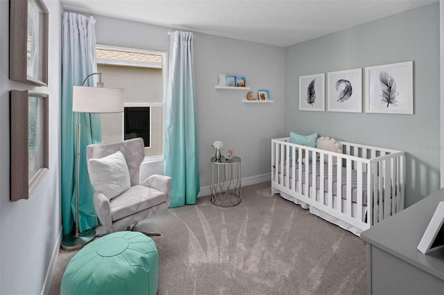 bedroom featuring a crib and carpet floors