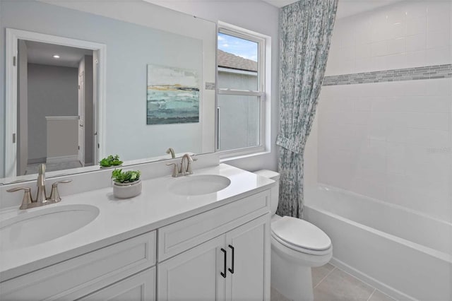 full bathroom featuring toilet, tile patterned flooring, vanity, and shower / tub combo with curtain