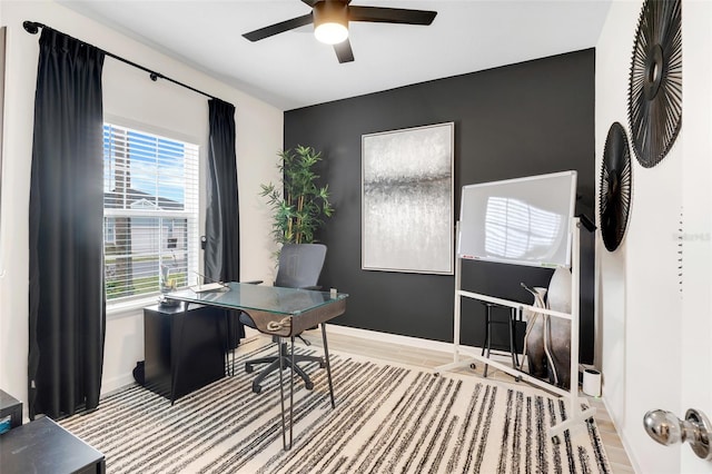 office area featuring ceiling fan, light hardwood / wood-style flooring, and a wealth of natural light