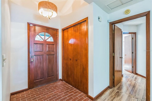 entrance foyer featuring wood-type flooring