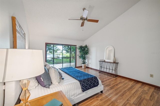 bedroom with ceiling fan, high vaulted ceiling, and hardwood / wood-style flooring