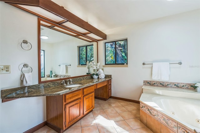 bathroom with vanity, tiled bath, and tile patterned floors