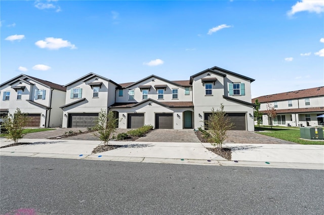 multi unit property featuring a garage and cooling unit