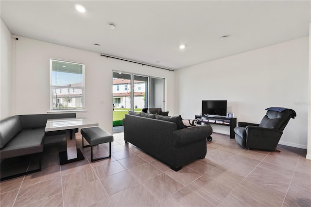 living room with light tile patterned floors