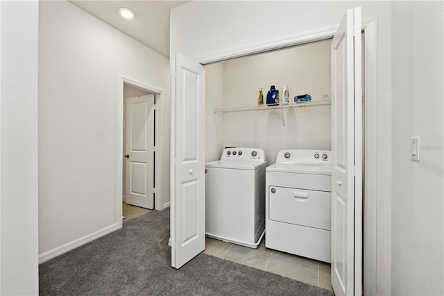 laundry area featuring washer and dryer and carpet flooring