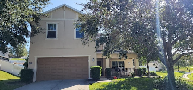 single story home with a garage and a front yard