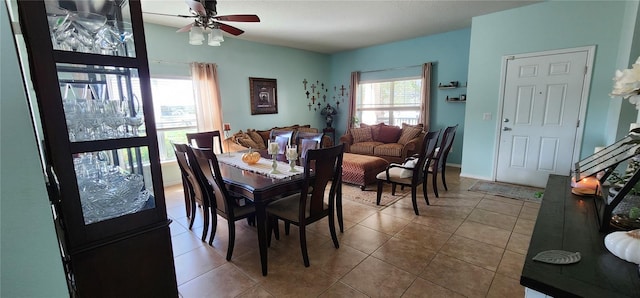 dining space featuring ceiling fan and light tile patterned flooring