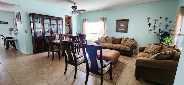 tiled living room featuring ceiling fan