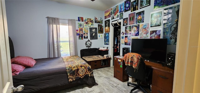 bedroom with light wood-type flooring