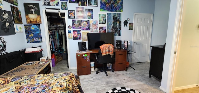 bedroom featuring a closet and light hardwood / wood-style floors