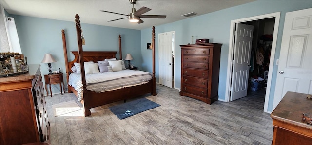 bedroom featuring light hardwood / wood-style flooring and ceiling fan