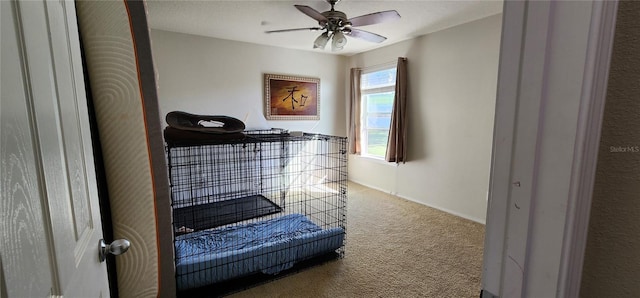 carpeted bedroom featuring ceiling fan