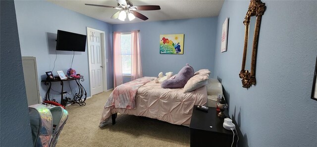 bedroom featuring ceiling fan and light colored carpet