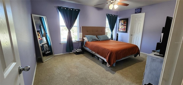 bedroom with ceiling fan and light colored carpet