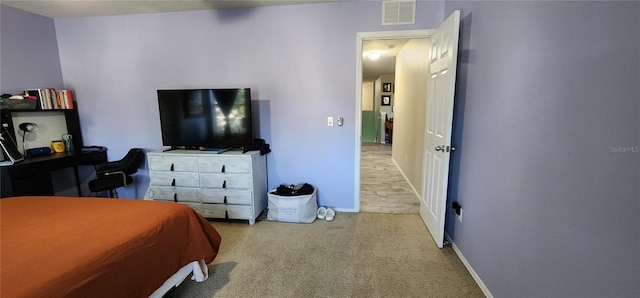 bedroom with light carpet