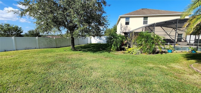 view of yard with a lanai