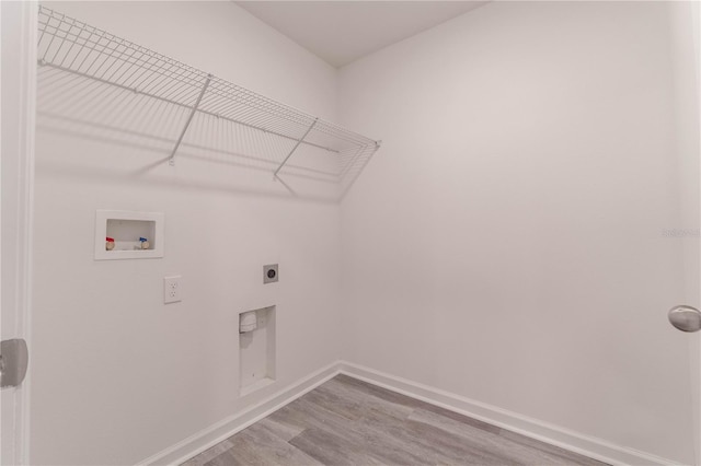 washroom with hardwood / wood-style floors, hookup for a washing machine, and electric dryer hookup